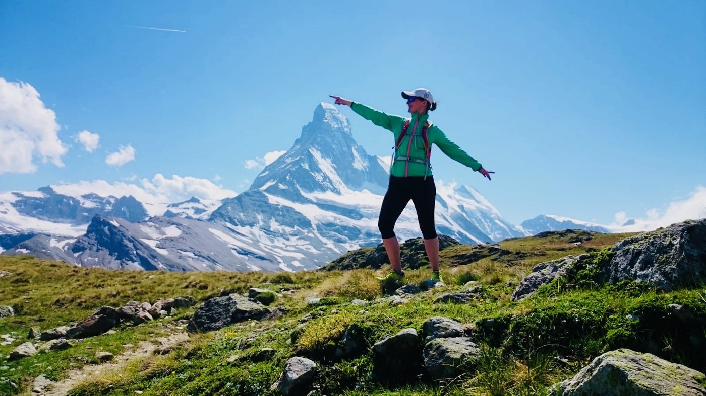 Christina Kehl on an alpine meadow in front of the Matterhorn