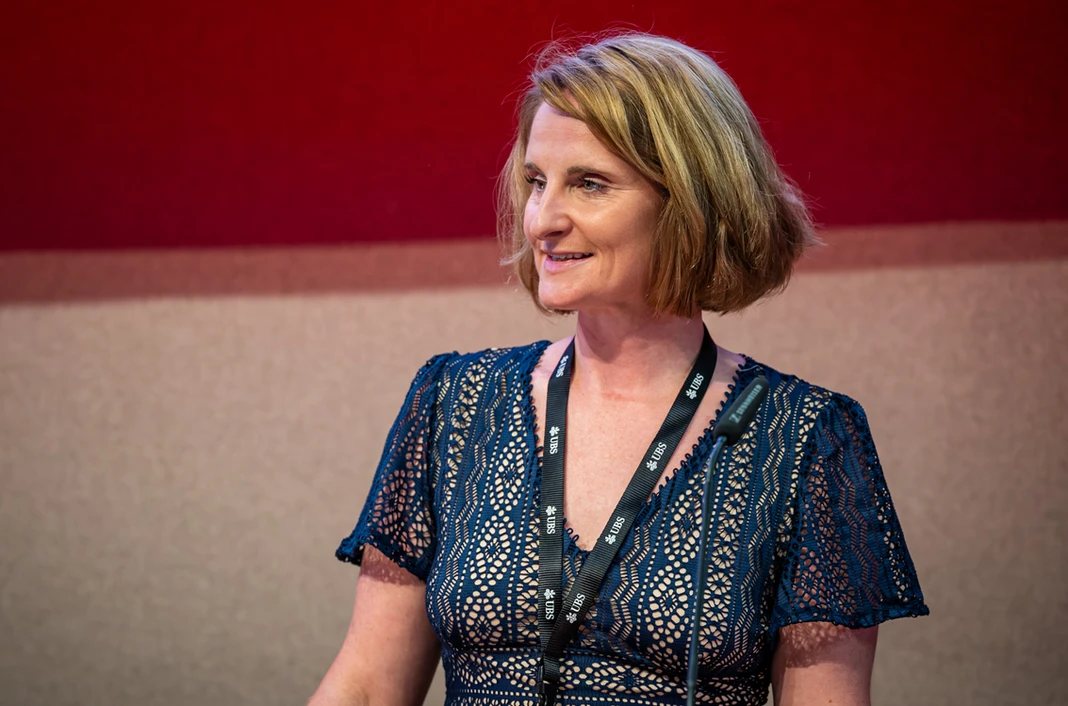 Christina Kehl smiling at the lectern